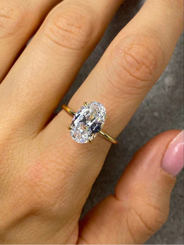 Harmony Ring featuring a large, oval brilliant-cut diamond set on a sleek, polished gold band, embodying timeless elegance and modern luxury craftsmanship.